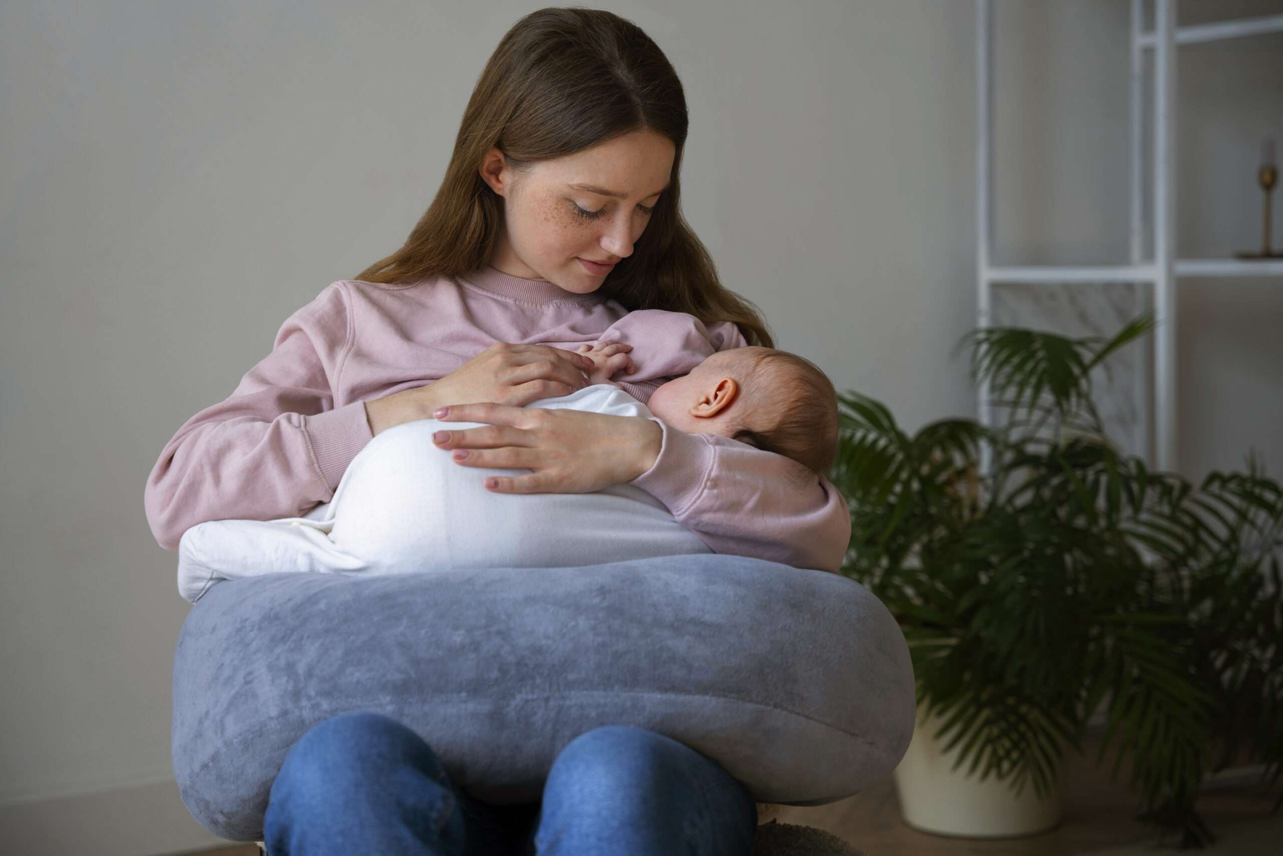 medium-shot-mother-with-cute-newborn When to Stop Breastfeeding a Baby