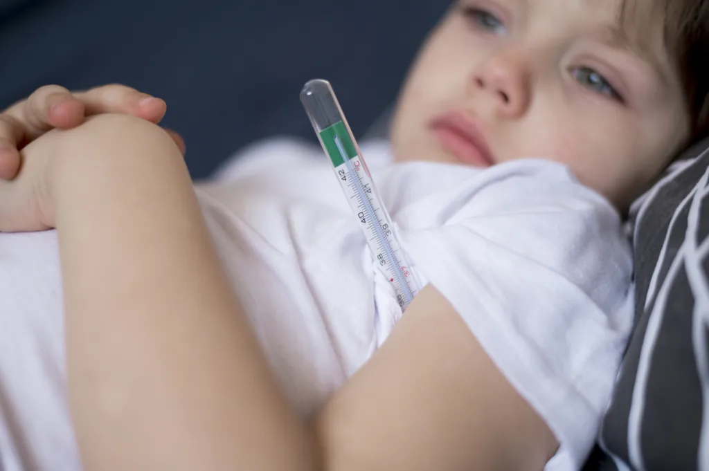 High fever and Heat Stroke Symptoms for Kids shown by thermometer