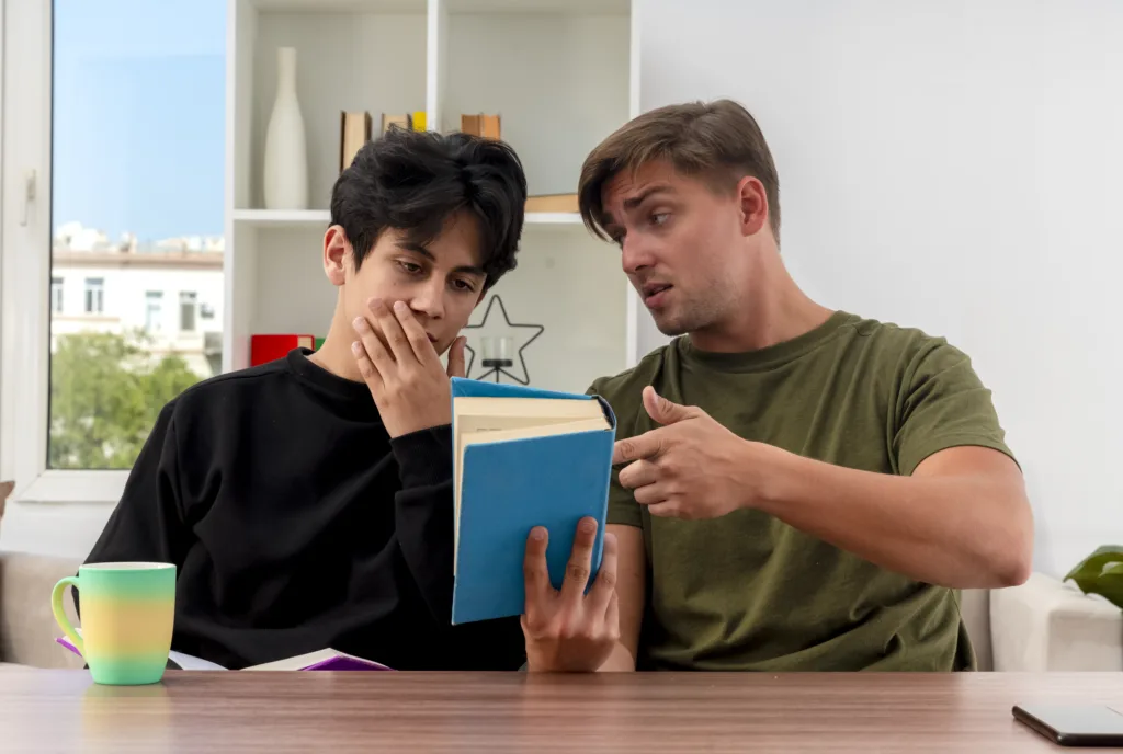 A parent explaining study material to a confused teenager — Deep Breathing Techniques to Calm Anxiety Before Exams