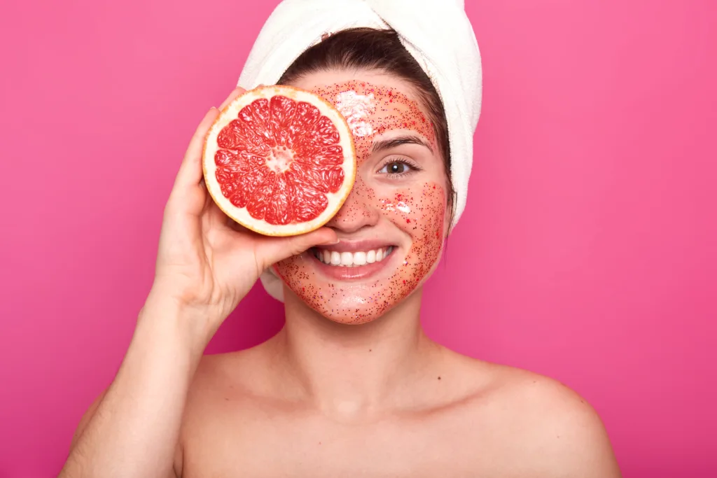 Woman using natural exfoliation for dry skin, related to What Does Dry Skin Say About Your Health