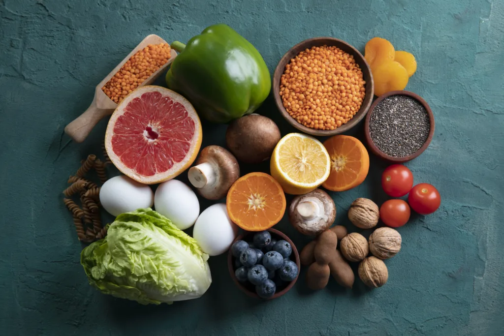 Assortment of fresh fruits, vegetables, and seeds – a diet-based approach to natural remedies for allergies in kids.