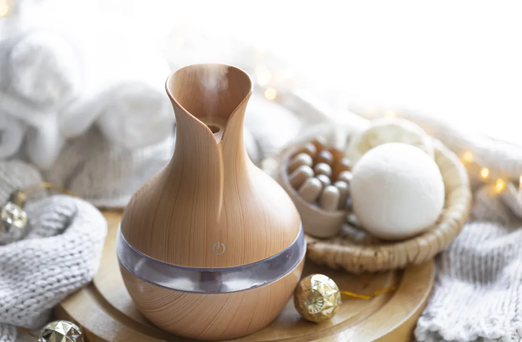 Essential oil diffuser with wellness decor – supporting respiratory relief as part of natural remedies for allergies in kids.